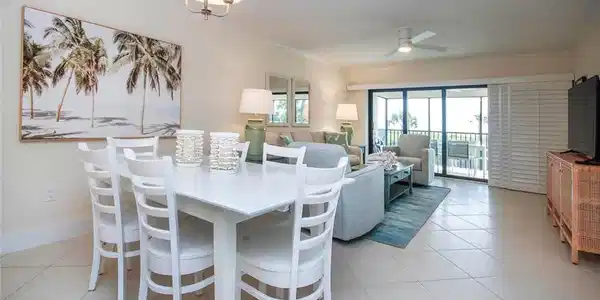Image 4: Dining area featuring ornamental molding, light tile patterned floors, a ceiling fan, and a chandelier