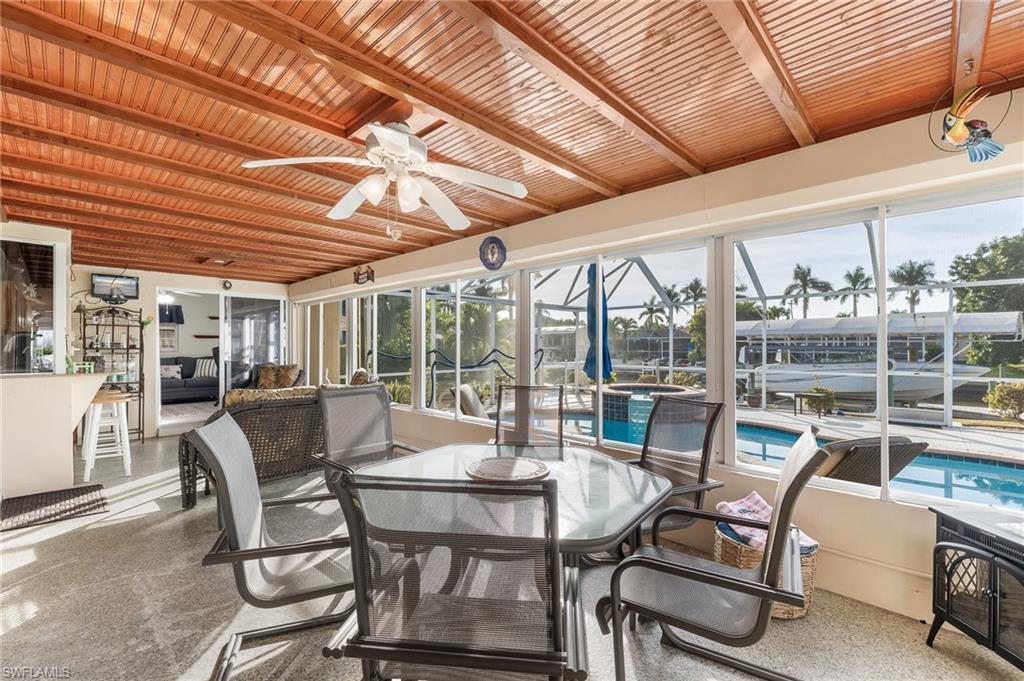 Image 3: Large Screened Lanai with Two sliders And A Pass Through From The Kitchen