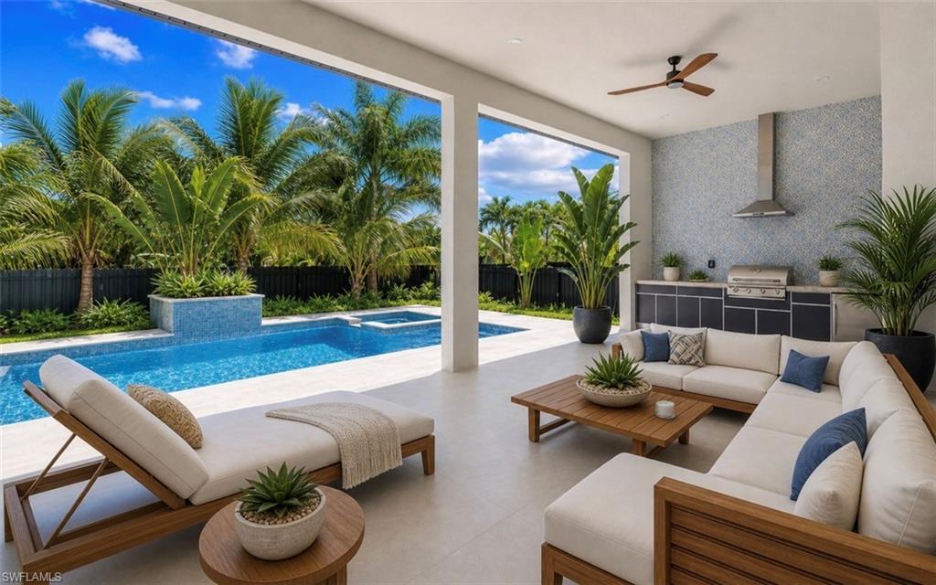 Image 4: Covered outdoor living space featuring an integrated kitchen with a stainless steel grill and range hood, mosaic tile backsplash, and a ceiling fan
