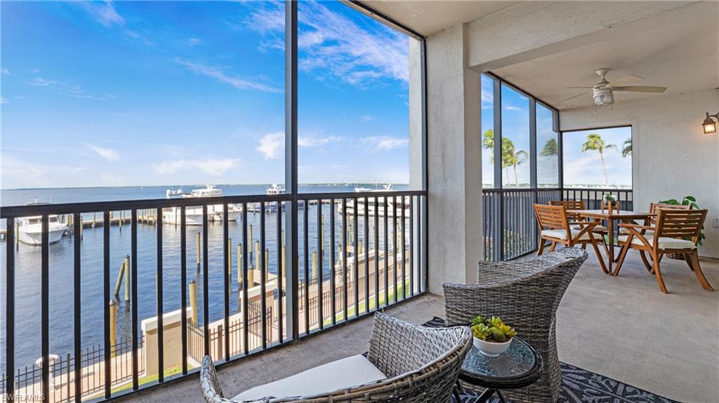 Image 2: Sunroom / solarium featuring a water view, ceiling fan, and a balcony