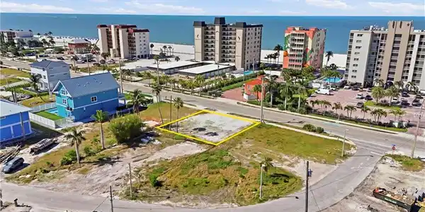 Image 2: Vacant lot outlined in yellow, featuring a clear building site and proximity to the Gulf of Mexico - Virtually Edited Image