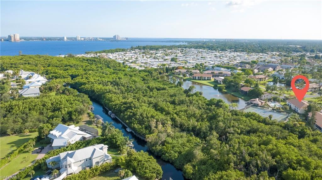 Image 3: Drone photo of canal, boat dock , downtown Fort Myers in the distance