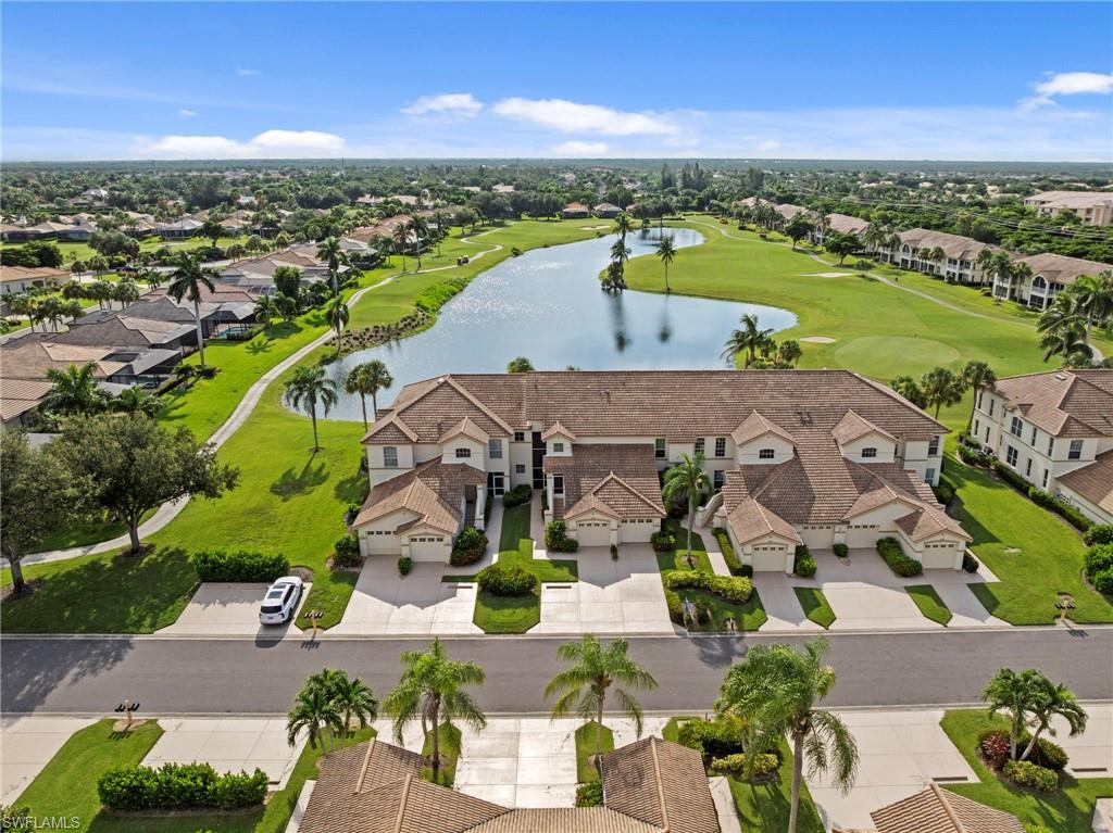 Image 2: Elegant Mediterranean-style residence featuring a clay tile roof, arched architectural details, and a stucco exterior