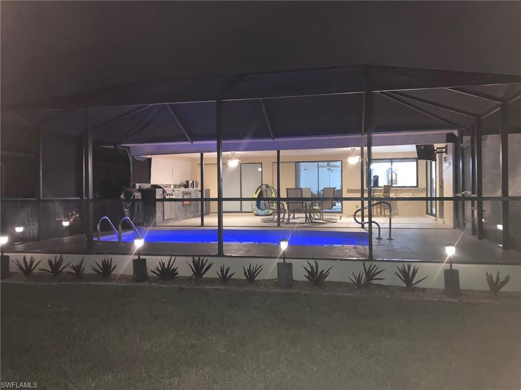 Image 3: View of swimming pool with a swimming pool, a lanai, and a sunroom