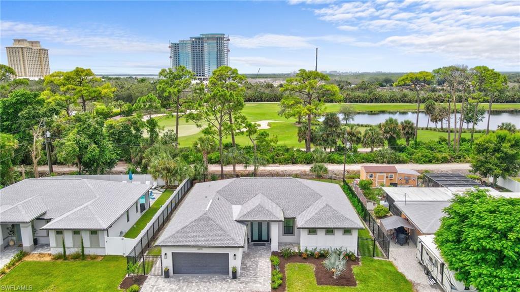 Image 2: Drone / aerial view of a large body of water and a local golf course