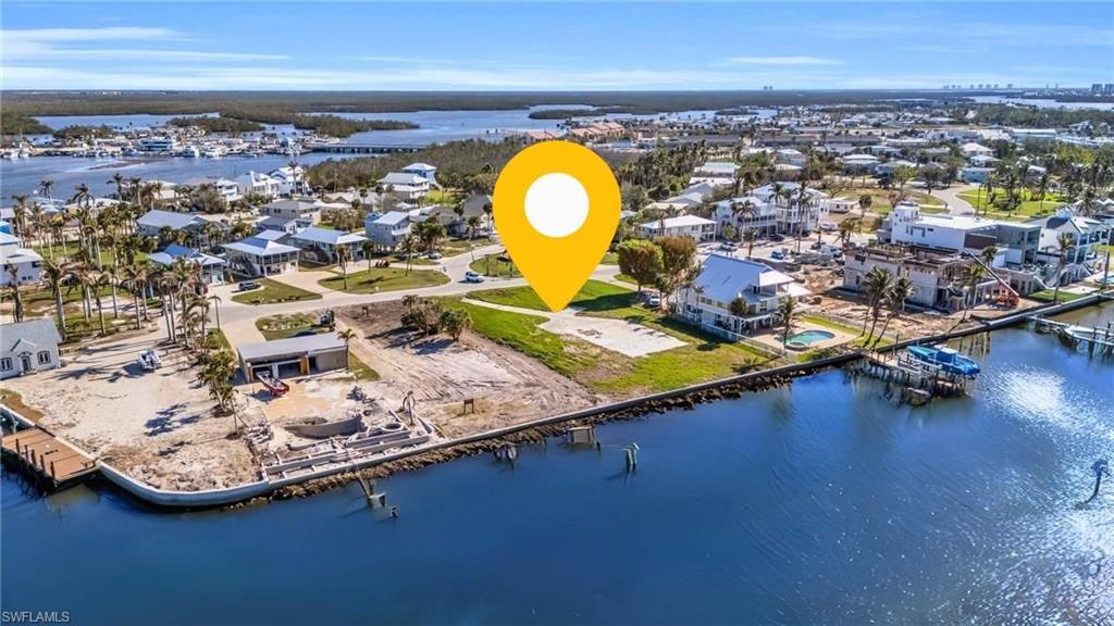 Image 1: Aerial view featuring a water view VIRTUALLY ENHANCED