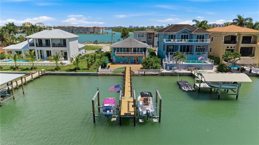 Image 4: Featuring a dock with two boat lifts