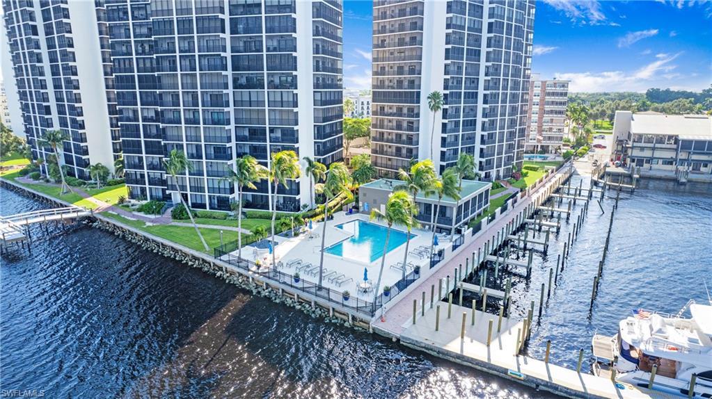 Image 4: Community pool featuring a water view and view of marina