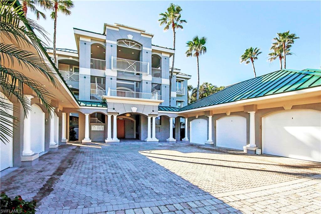 Image 1: Entrance of condo with single car garage