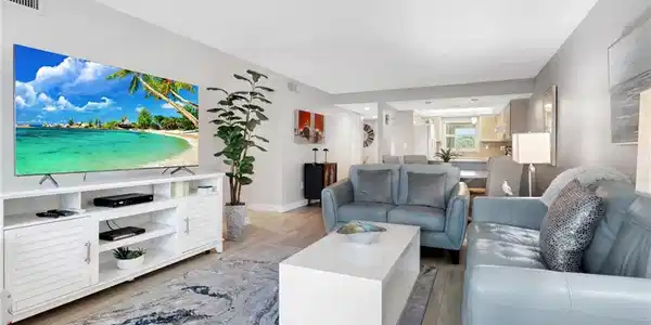 Image 2: Living area with wood finished floors and baseboards