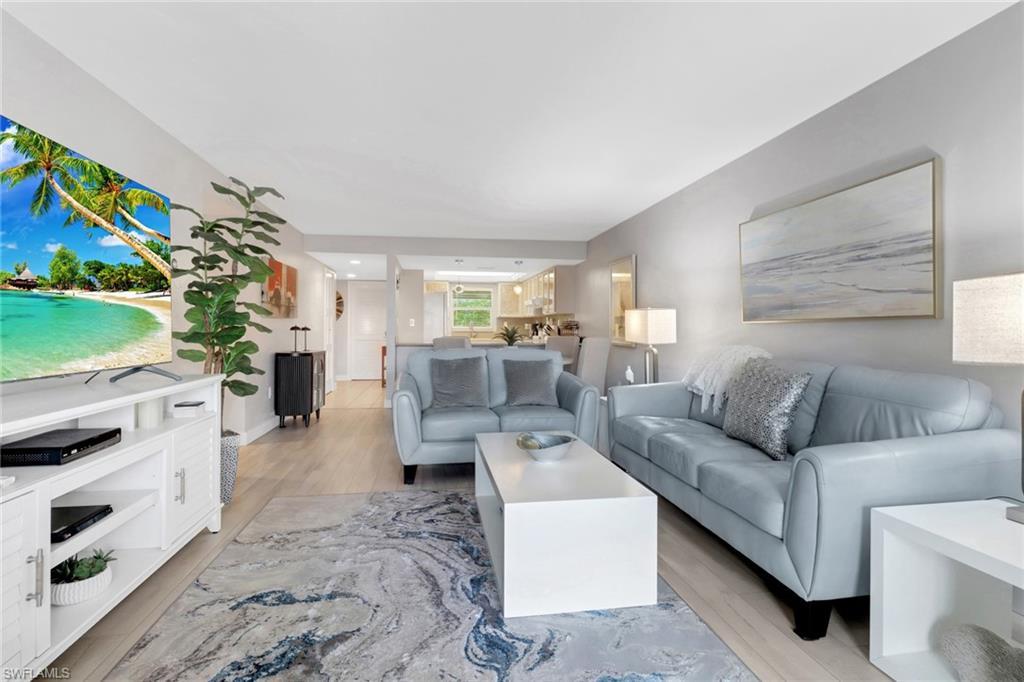 Image 3: Living room featuring light wood finished floors