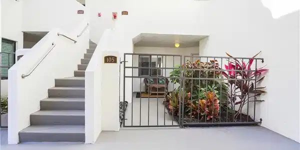Image 4: Stairs with finished concrete floors and a high ceiling