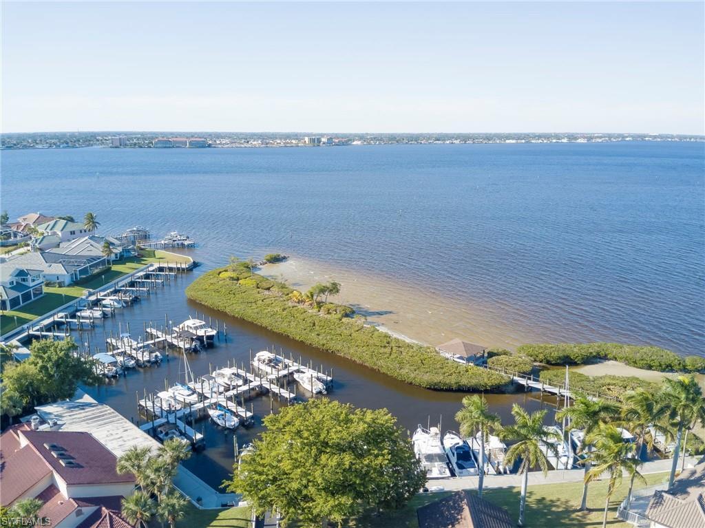 Image 2: Drone / aerial view of a large body of water and numerous boat docks