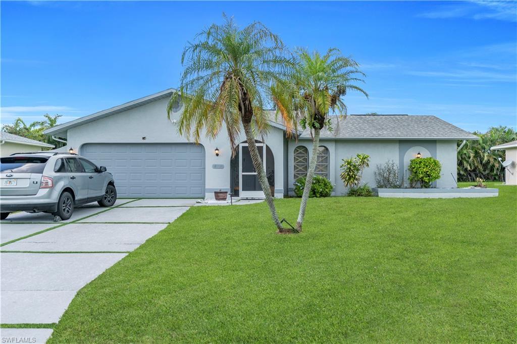 Image 1: Ranch-style home featuring stucco siding, an attached garage, driveway, a front lawn, and roof with shingles