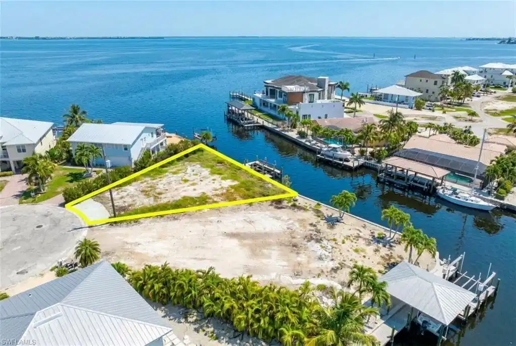 Image 1: Waterfront lot featuring direct canal access to open water - Virtually Edited Image