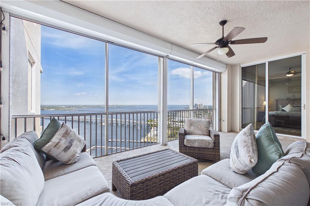 Image 1: Sunroom featuring a water view and a textured ceiling