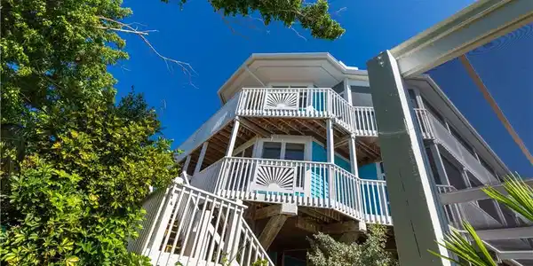Image 3: Wrap around decks on two levels. Great for maintenance.