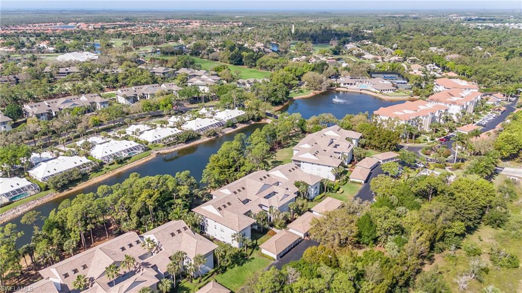 Image 2: Aerial view of residential area with a large body of water