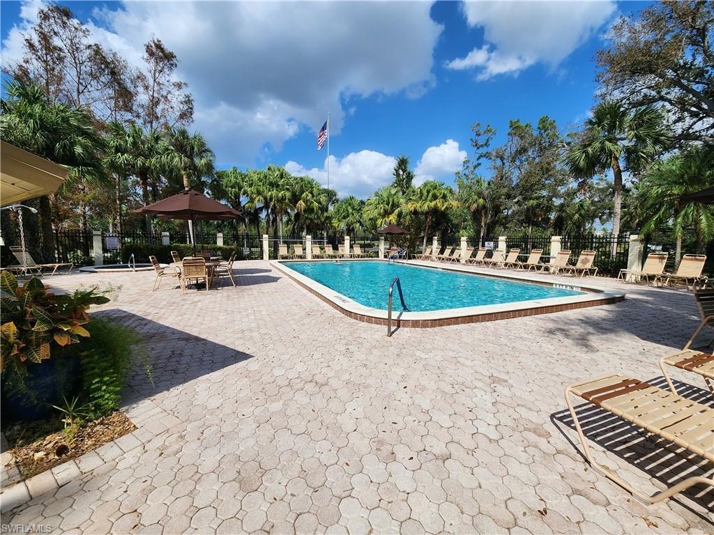 Image 2: Rectangular swimming pool surrounded by a paver deck