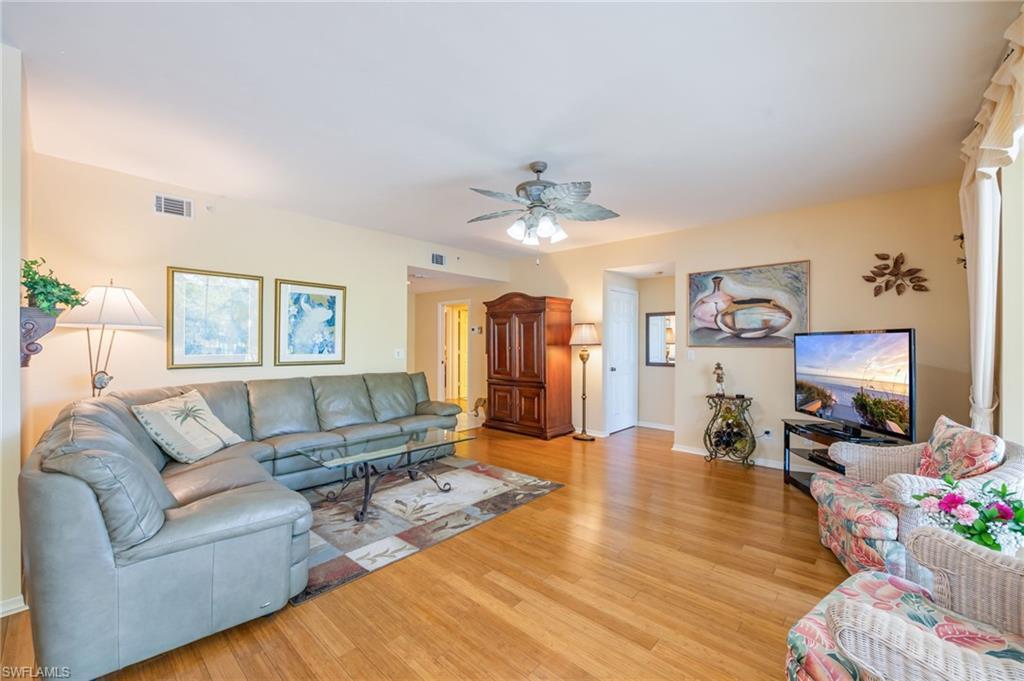 Image 3: Living room featuring light wood-type flooring and a ceiling fan