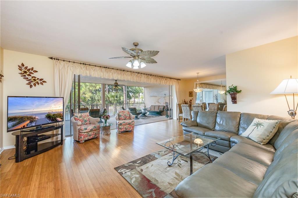 Image 4: Living room with ceiling fan and light wood-type flooring