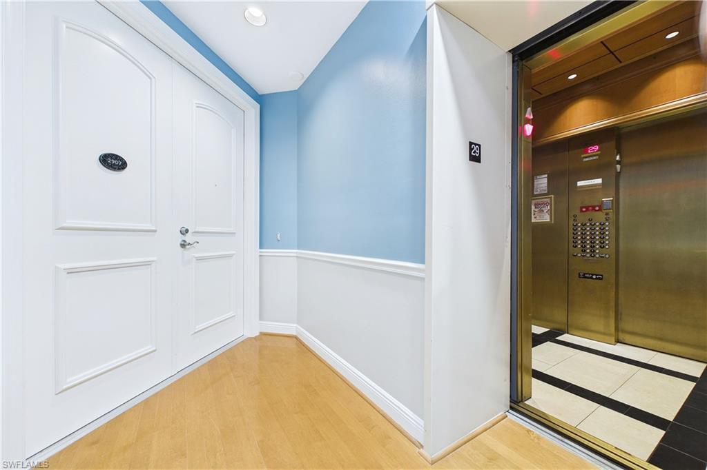 Image 4: Doorway with elevator and wood finished floors