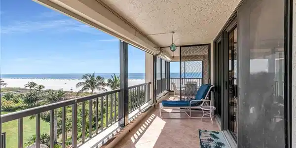 Image 3: Balcony with a water view and a beach view