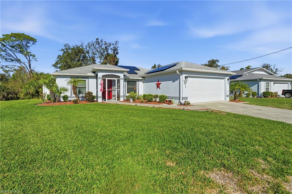 Image 2: Front of house w/ 2-car garage