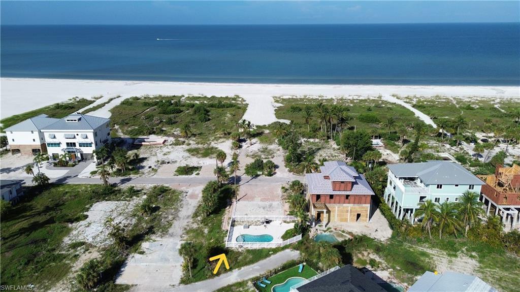 Image 1: BEACH SIDE with pool one lot between to Gulf