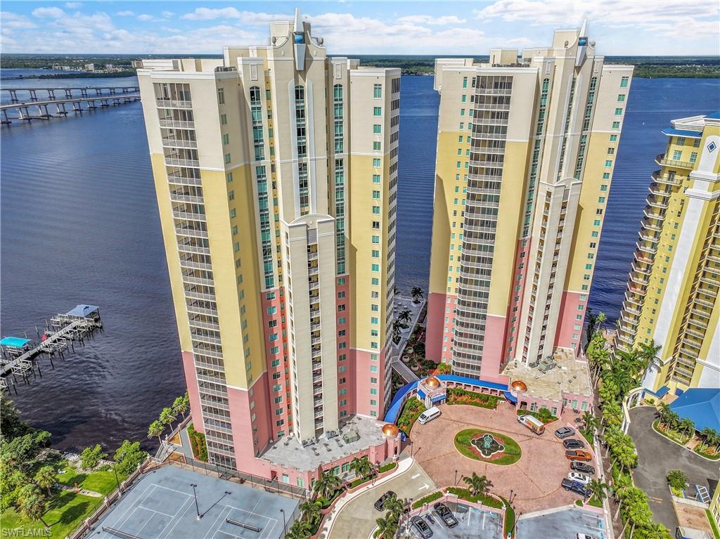 Image 2: View of apartment building / complex with a water view