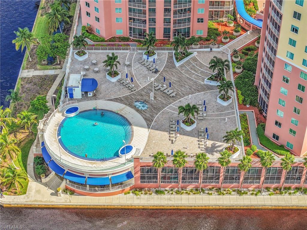 Image 3: Bird's eye view of a pool and apartment complex / building