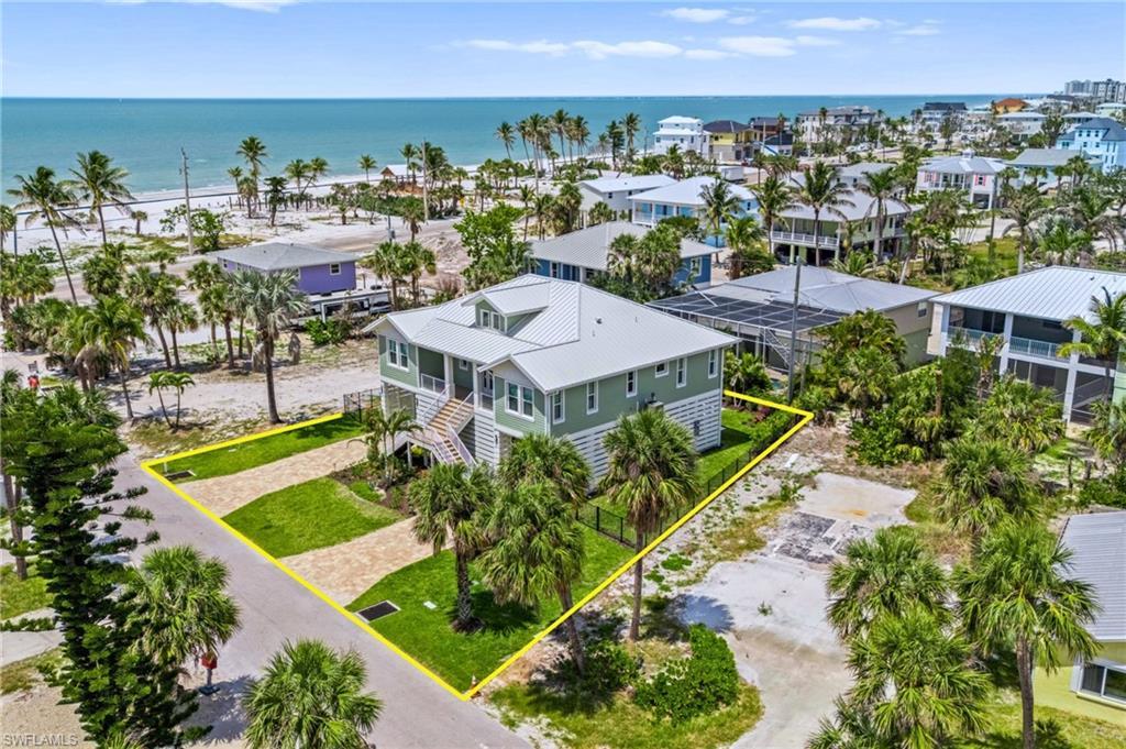 Image 4: Let's Walk to the Beach! -Birds eye view of property featuring a water view - VIRTUAL EDITED EXTERIOR IMAGE