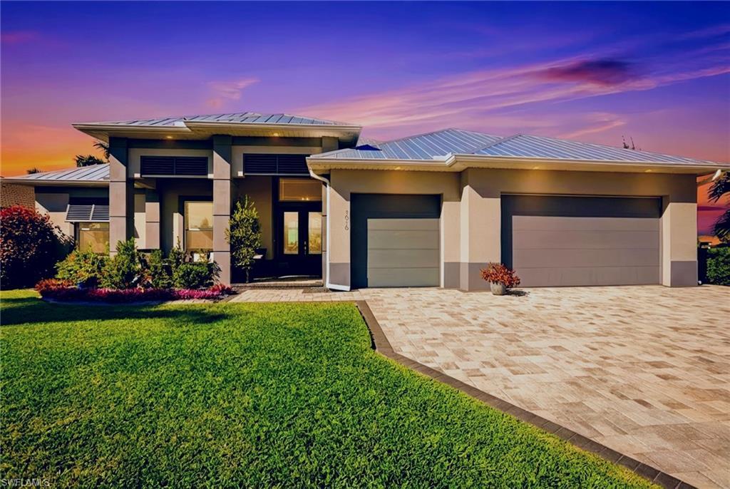 Image 2: This home has a metal roof AND SOLAR PANELS.