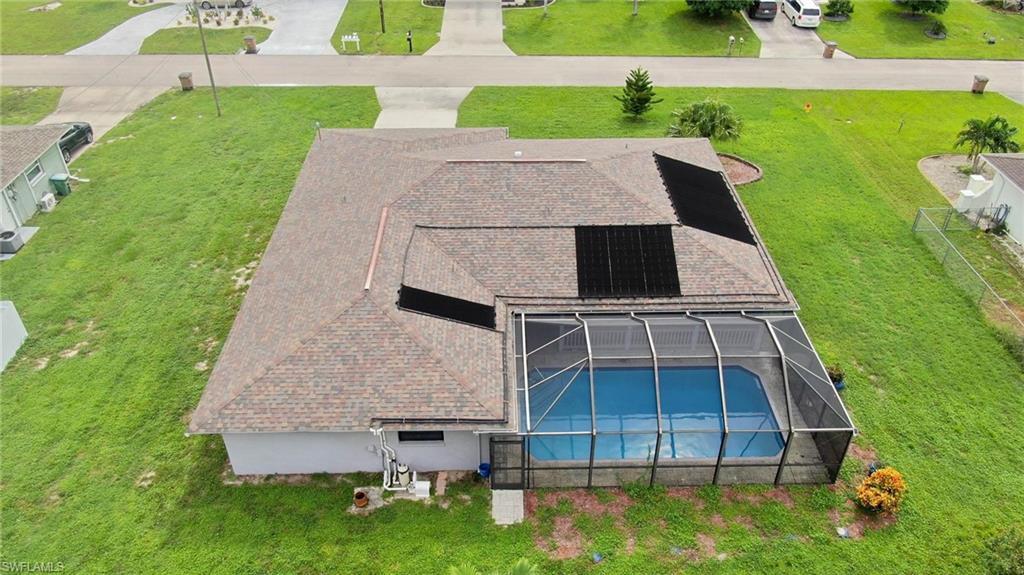 Image 2: Beautiful pool and large screen enclosed lanai.
