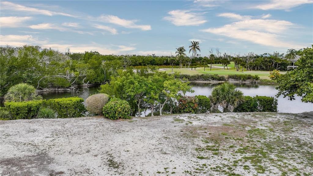 Image 3: Water view featuring a tree filled landscape
