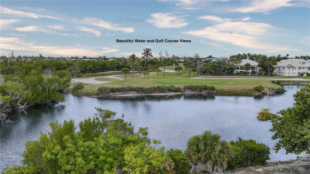 Image 4: Water view with a golf course
