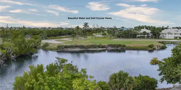 Image 4: Water view with a golf course
