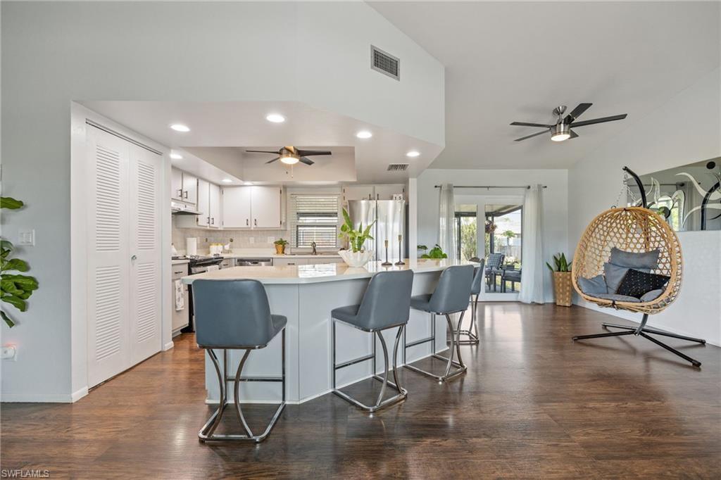 Image 2: Open kitchen layout with Impact Resistant Pocket Sliding Glass Door for seamless indoor-outdoor living.