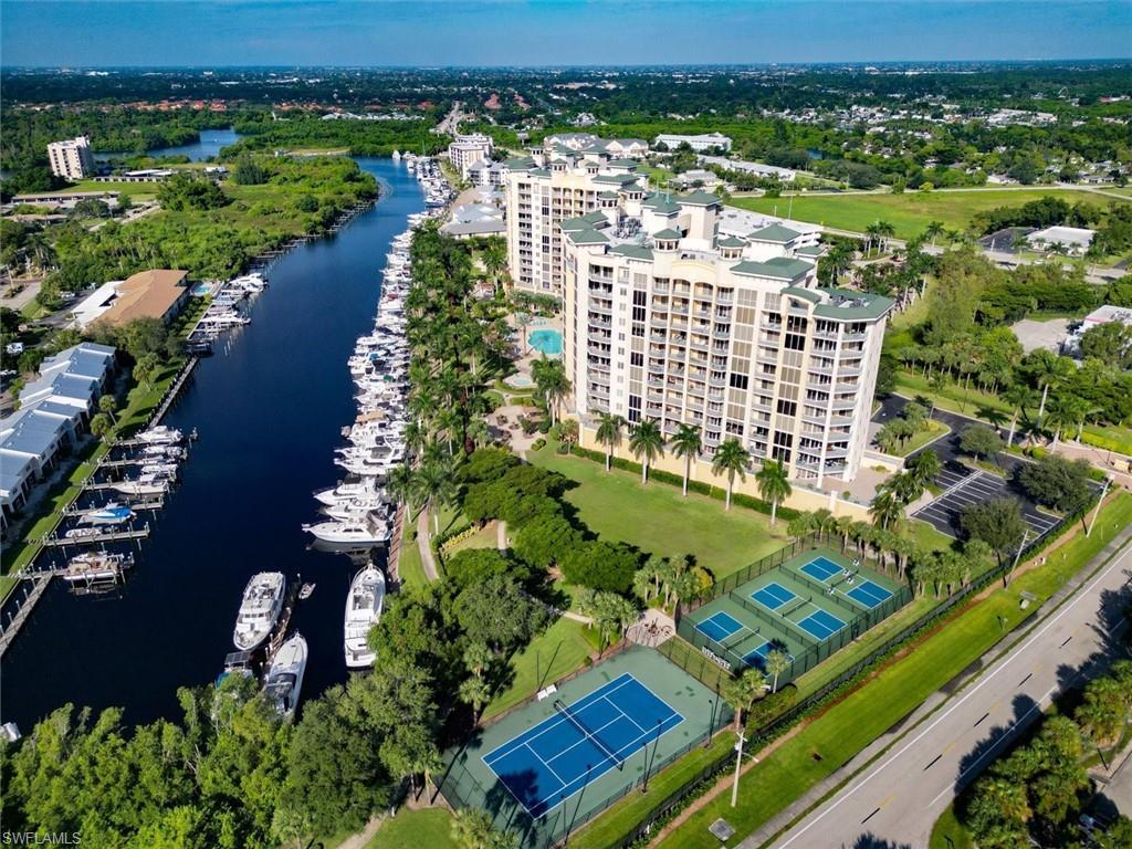 Image 3: Aerial view of a large body of water and apartment complex