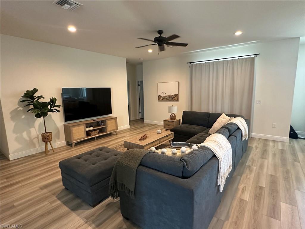 Image 4: Living area featuring recessed lighting, light wood-type flooring, and a ceiling fan