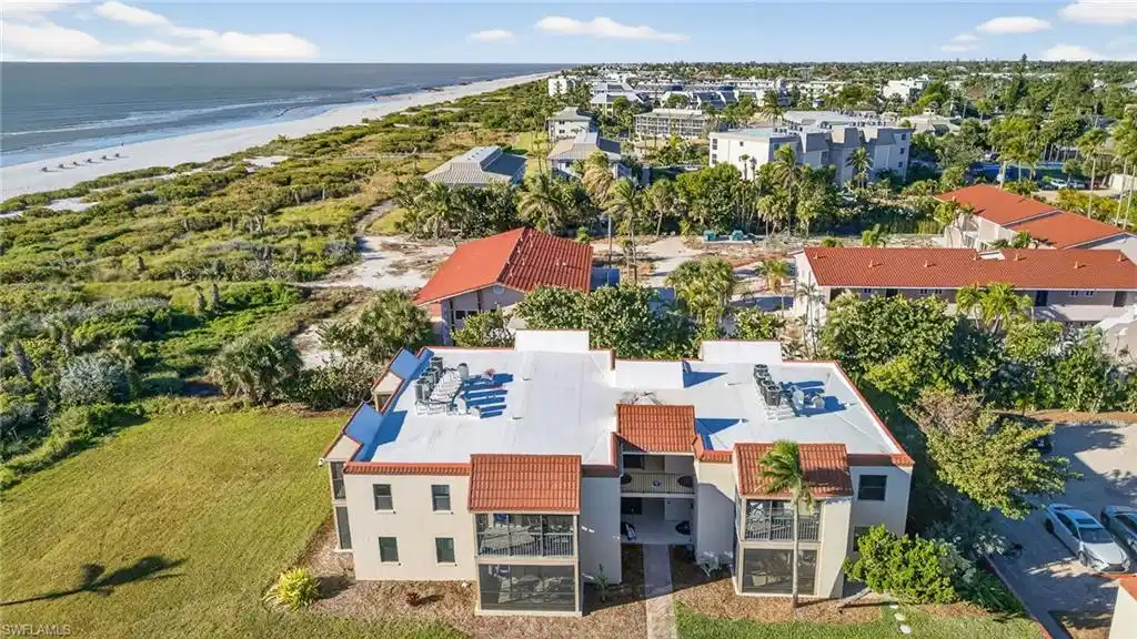 Image 1: Drone / aerial view of waterfront with a beach