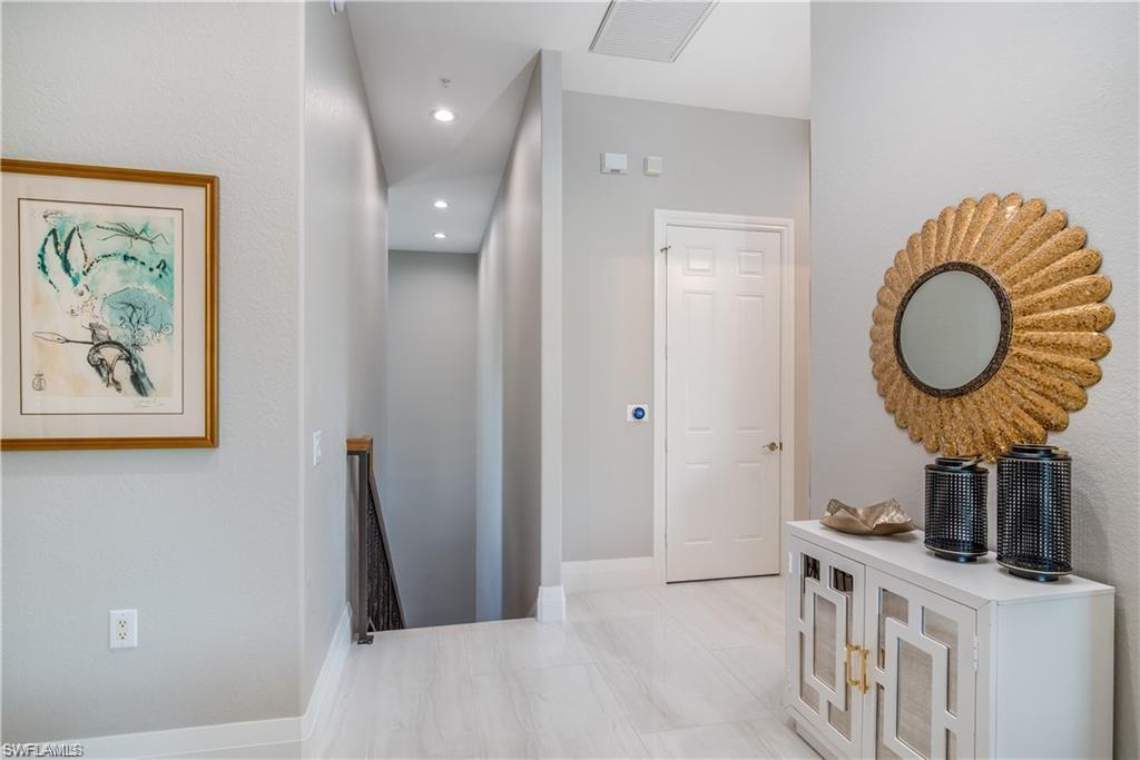 Image 2: Corridor with an upstairs landing and recessed lighting