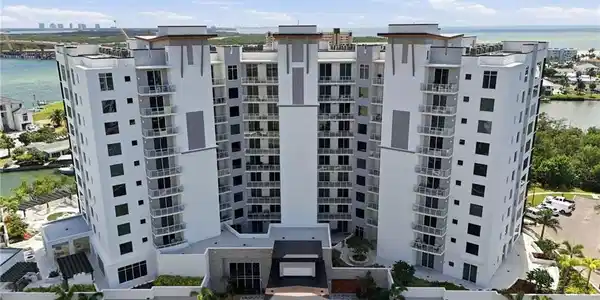 Image 3: View of apartment building / complex featuring a water view - Virtually Edited Image