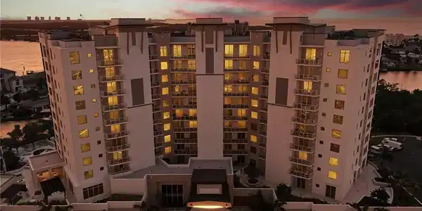 Image 4: View of apartment building / complex featuring a water view - Virtually Edited Image
