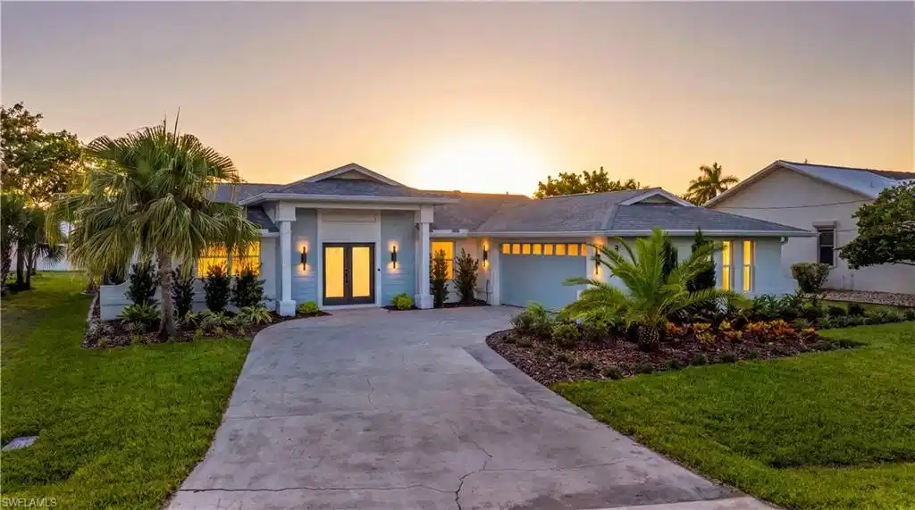 Image 1: Imagine the sunsets at this updated and upgraded contemporary single-story residence with a concrete driveway and an attached two-car garage