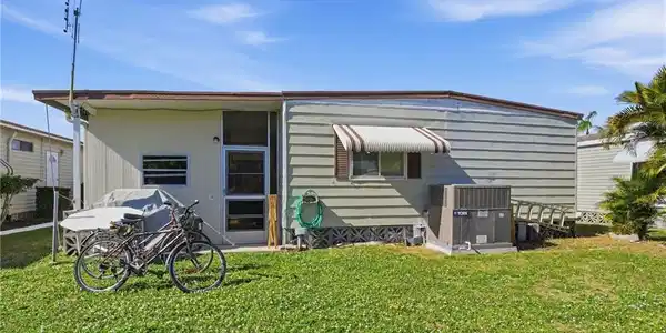 Image 3: Rear view of property with a yard