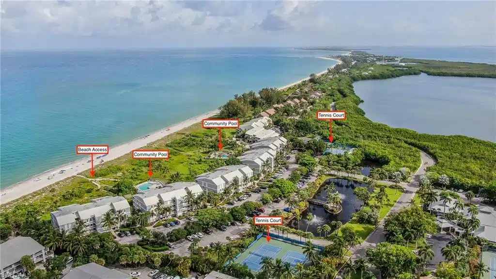 Image 1: Bird's eye view with a water view and a beach view
