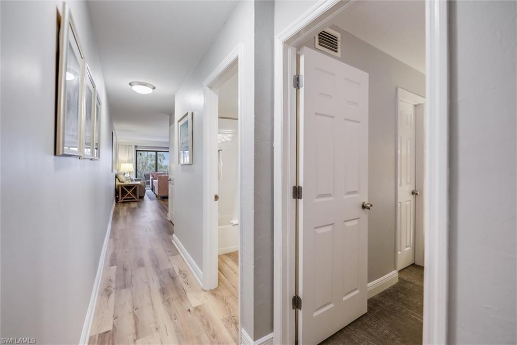 Image 3: Hallway featuring light hardwood / wood-style floors