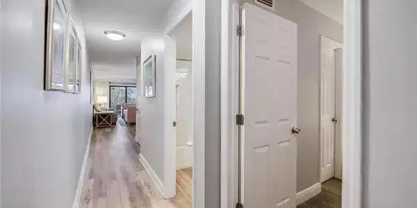 Image 3: Hallway featuring light hardwood / wood-style floors