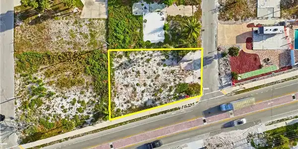 Image 4: Aerial view of property and surrounding area featuring property boundaries highlighted - Virtually Edited Image